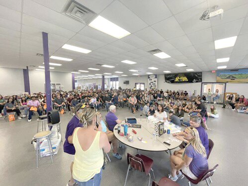 The Class of 2023 assembled in the cafeteria for the “great give-away.”